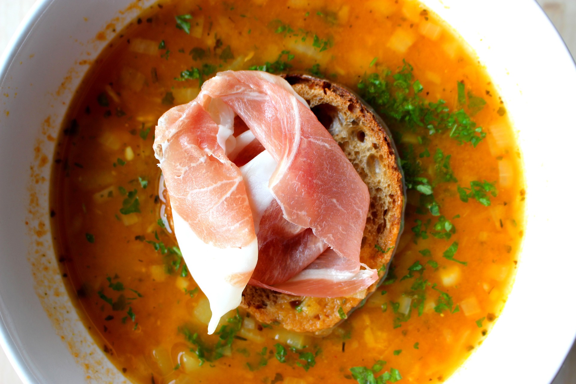 Chickpea and chorizo soup with soda bread and prosciutto ham