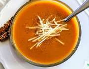 Bowl of curried butternut squash and peanut butter soup