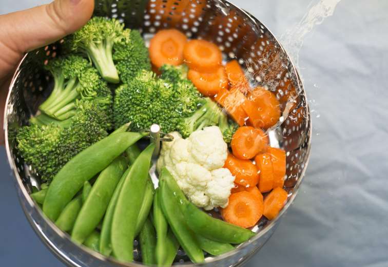 Vegetables in steamer basket